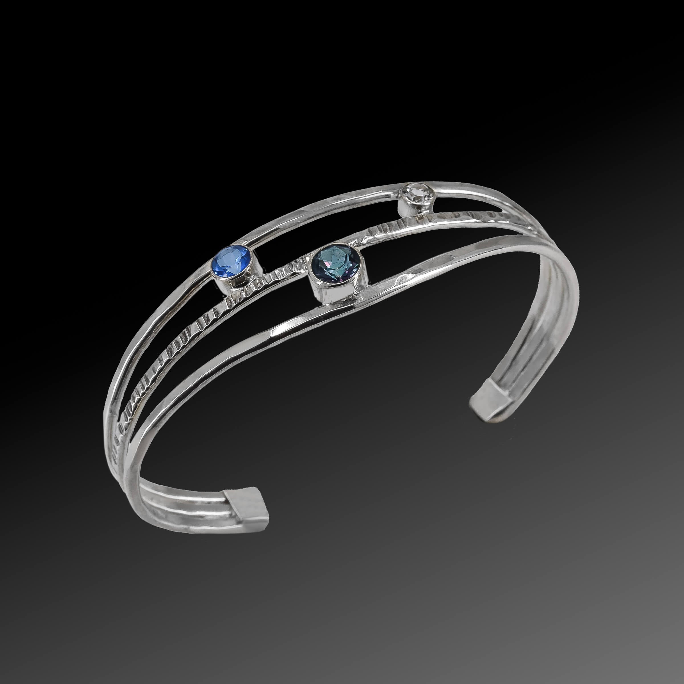 Faceted topaz gemstones in sterling silver cuff bracelet