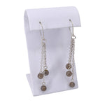 Long labradorite dangle earrings featuring three strands of chain with stones hanging at the end. 