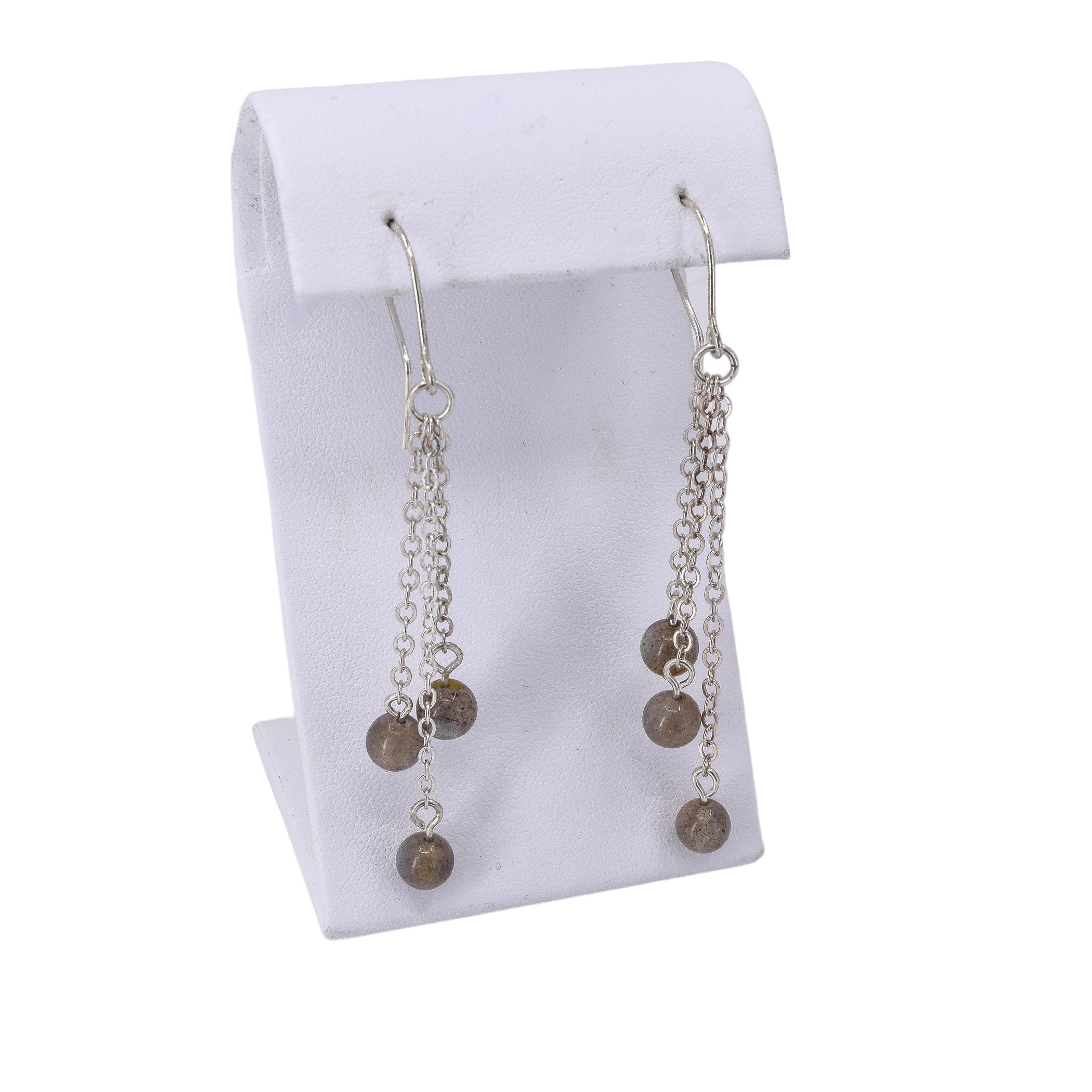 Long labradorite dangle earrings featuring three strands of chain with stones hanging at the end. 