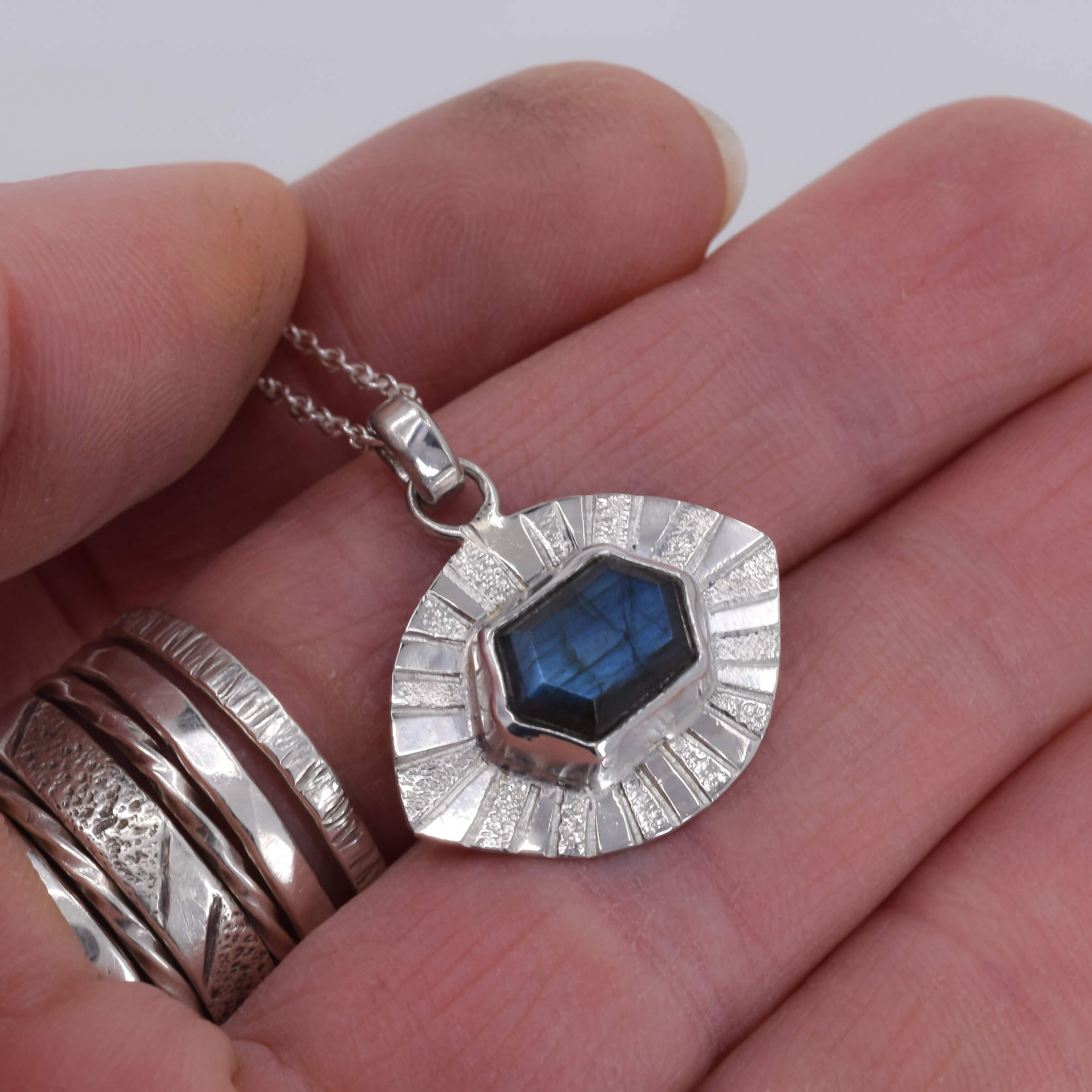 Sterling Silver Evil Eye Labradorite Pendant II shown in hand for scale