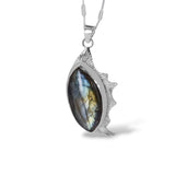 Sterling Silver Labradorite Pendant with a Marquise Shaped stone and a unique one of a kind border on the one side. 