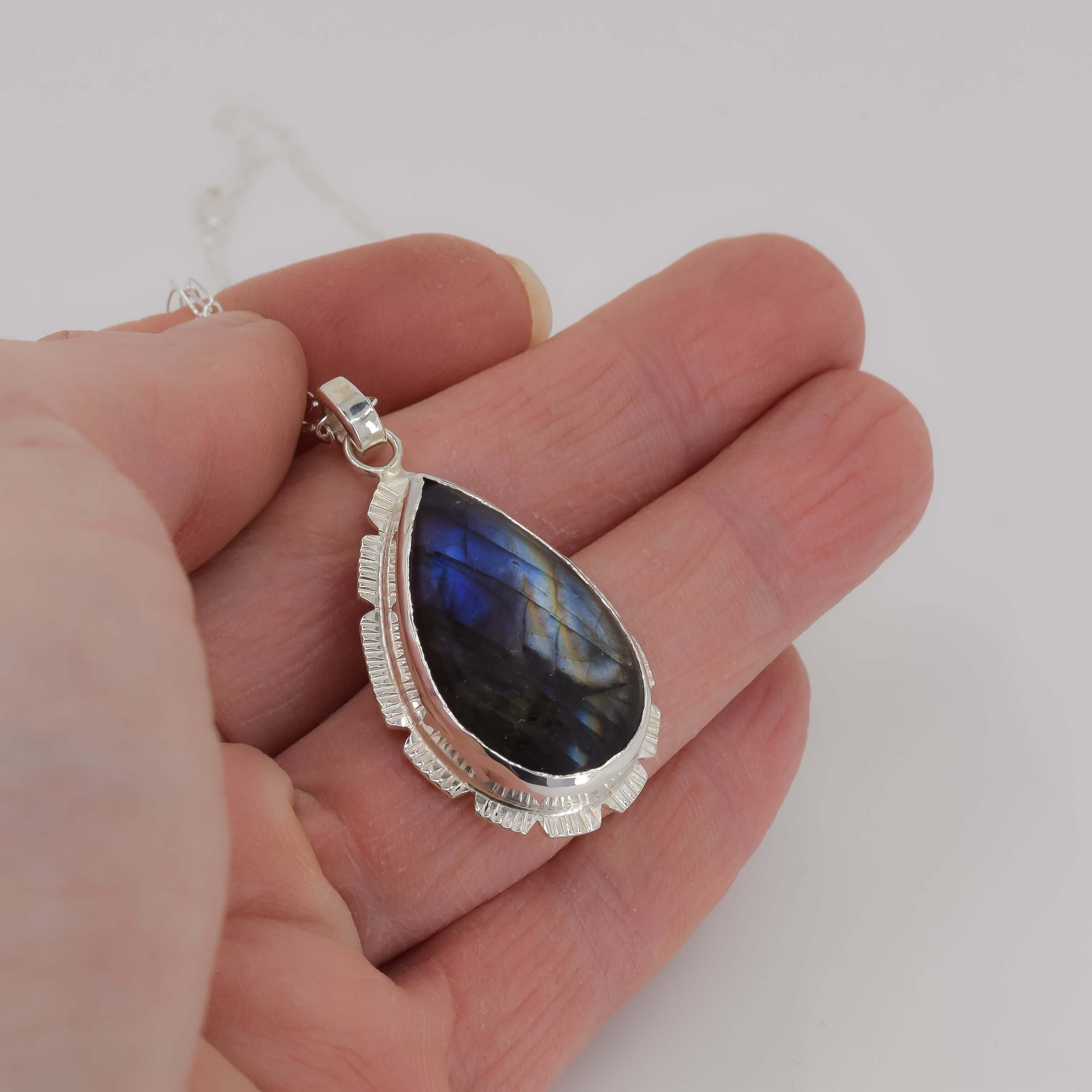 Sterling Silver Labradorite Pendant III held in hand