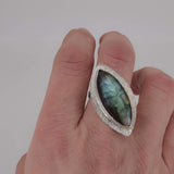 Sterling Silver Labradorite Ring Marquise Stone with a grain textured border worn on finger