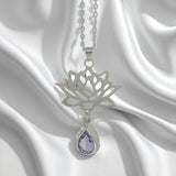 Sterling Silver Lotus Flower Pendant with Amethyst Gemstone on a satin background