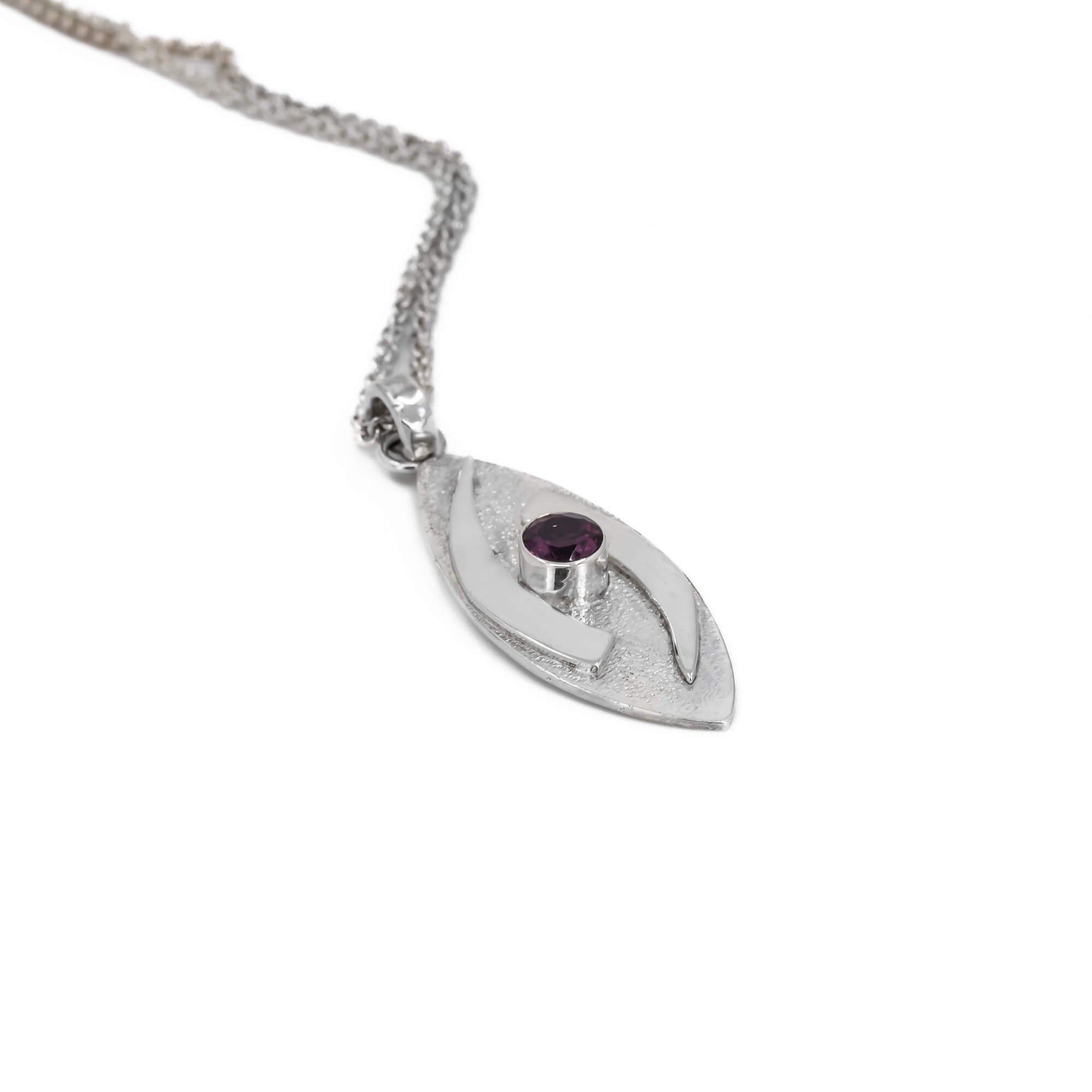 large hugged pendant necklace in sterling silver with a stardust texture and a 5mm Rhodolite garnet faceted stone