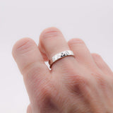 Hammered 4mm sterling silver ring band worn on hand